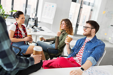 Image showing creative team drinking coffee at office