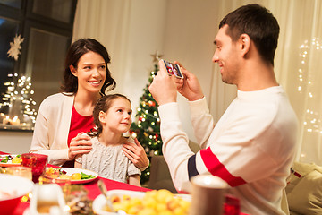 Image showing happy family taking picture at christmas dinner