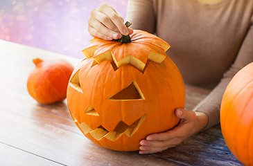Image showing close up of woman with halloween pumpkin