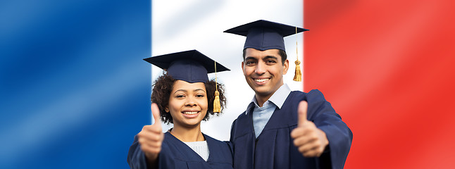 Image showing graduate students or bachelors showing thumbs up