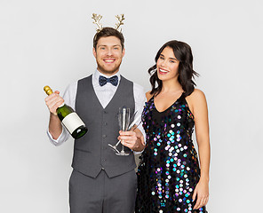 Image showing couple with champagne bottle at christmas party