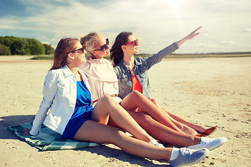 Image showing group of smiling women in sunglasses on beach