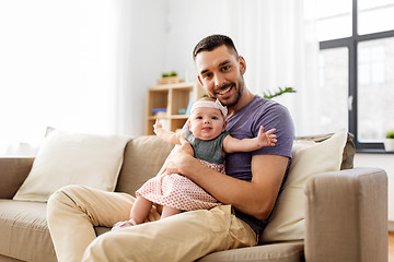 Image showing father with little baby girl at home