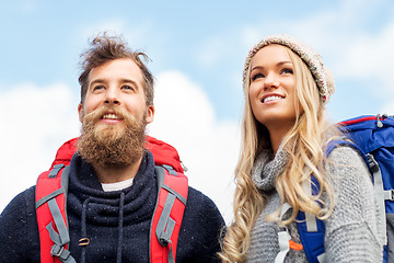 Image showing couple of travelers with backpacks hiking