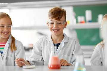 Image showing kids with test tube studying chemistry at school