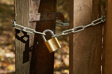 Image showing Old gate with padlock