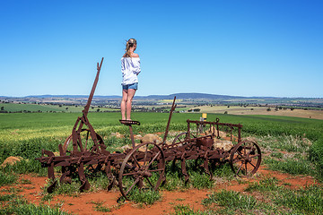 Image showing Farmlands views for miles from rusting farm tiller