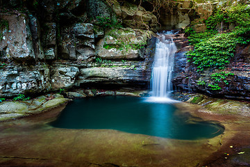 Image showing Waterfall into a rock pool deep in the wilderness