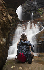 Image showing Bushwalker in awe of the waterfalls