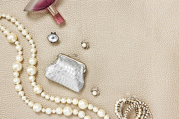 Image showing Silver purse, jewelry and perfume