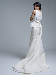Image showing Rear view of a beautiful young woman in a wedding dress