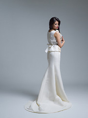 Image showing Rear view of a beautiful young woman in a wedding dress