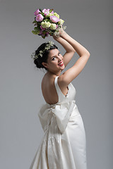 Image showing bride with a bouquet  isolated on white background