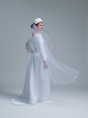 Image showing young bride in a wedding dress with a veil