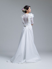 Image showing Rear view of a beautiful young woman in a wedding dress