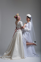 Image showing Portrait of two beautiful young bride in wedding dresses