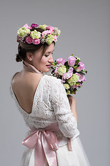 Image showing bride with a bouquet  isolated on white background