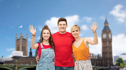 Image showing friends over houses of parliament in london