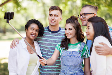 Image showing international friends taking selfie in park