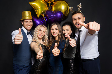 Image showing friends at christmas party showing thumbs up