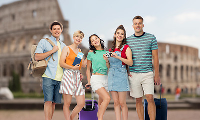 Image showing friends with travel bags, air ticket and camera