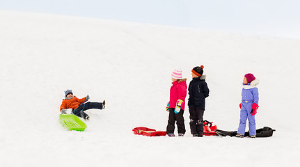 Image showing happy little kids with sleds in winter