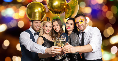 Image showing happy friends clinking champagne glasses at party