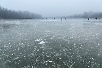 Image showing Skating on frozen lake