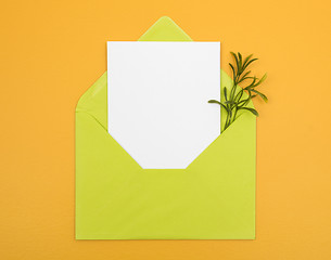 Image showing Envelope with blank card on bright yellow background