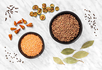 Image showing Lentils and cooking ingredients on marble background