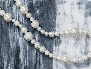 Image showing Pearl necklace on gray artistic background