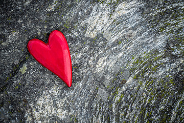 Image showing Red heart on mossy rock background