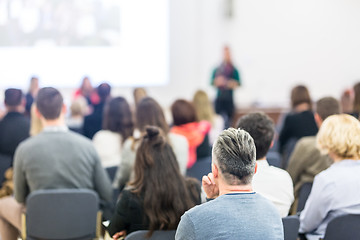 Image showing Woman giving presentation on business conference workshop.