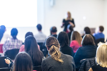 Image showing Woman giving presentation on business conference workshop.