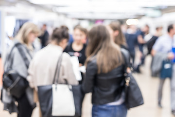 Image showing Blured image of businesspeople networking and socializing during coffee break at business event.