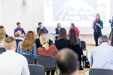 Image showing Woman giving presentation on business conference workshop.