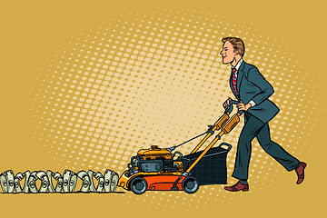 Image showing Businessman cuts money like a lawnmower man. Wealth and financia