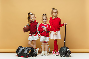 Image showing Happy and beautyful children show different sport. Studio fashion concept. Emotions concept.