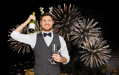 Image showing man with bottle of champagne at christmas party