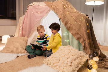 Image showing little boys with tablet pc in kids tent at home