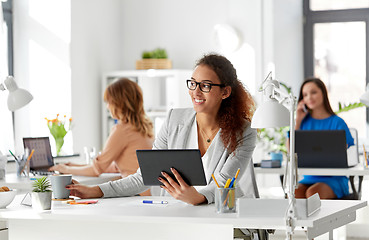 Image showing businesswoman with tablet pc and coffee at office