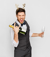 Image showing man with bottle of champagne at christmas party