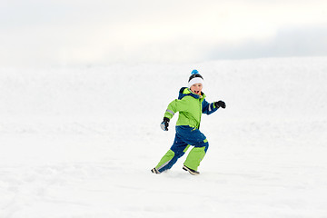 Image showing happy boy having fun outdoors in winter