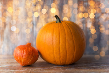 Image showing pumpkin and red kuri squash on wooden background