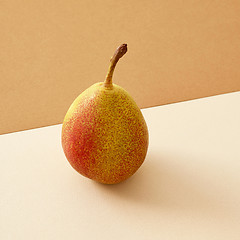 Image showing pear on colored paper background