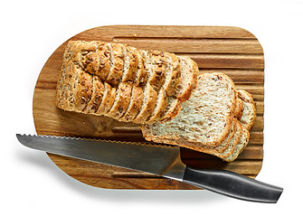 Image showing sliced bread on wooden cutting board