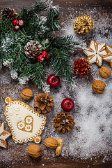 Image showing Christmas background with branch and gingerbread