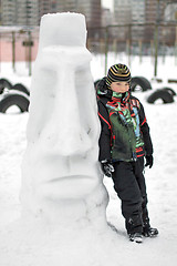 Image showing Boy making a winter snowman