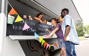 Image showing customers or friends and saleswoman at food truck