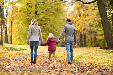 Image showing happy family walking at autumn park